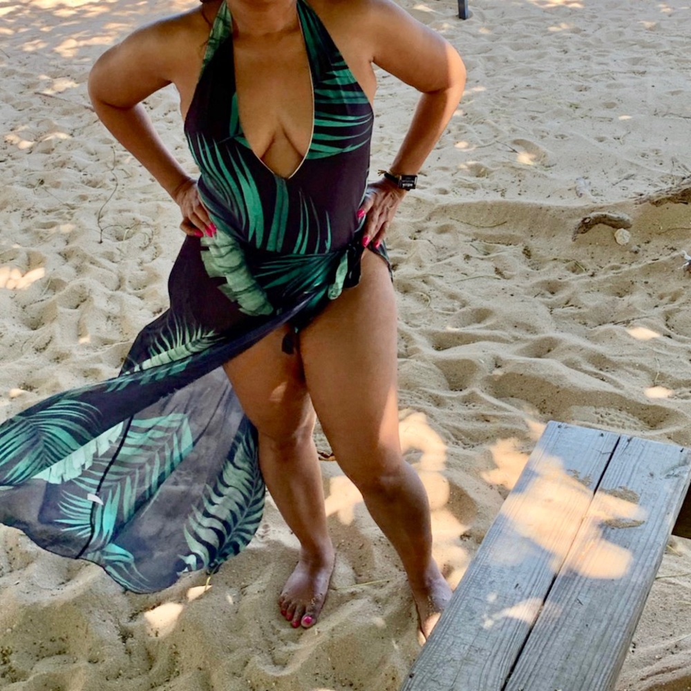 Black tropical print one piece halter cut swimsuit with sheer skirt coverup